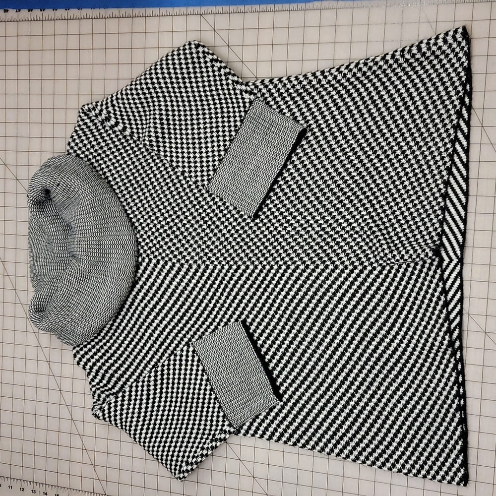 3/4 Sleeve black and white cowl neck sweater. Size large.